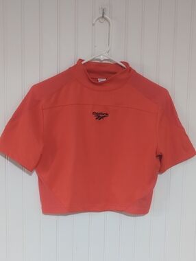 Reebok Women’s Coral-Orange Short Sleeve Crop Top